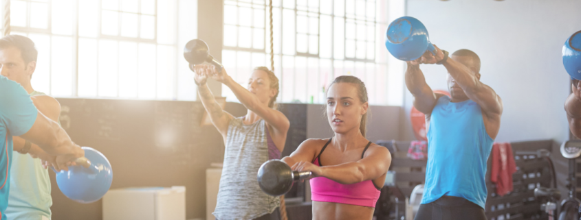 People doing a kettlebell exercise class