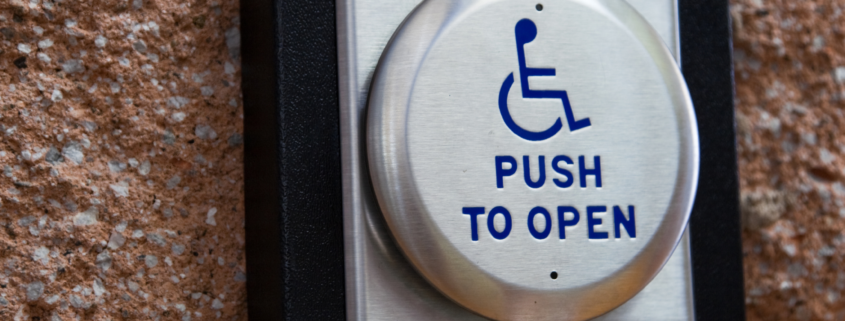 An accessible door push to open button