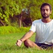 Man meditating outdoors