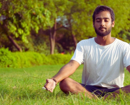 Man meditating outdoors