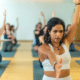 Yoga teacher in group exercise class