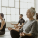 Diverse people meditating in a yoga class