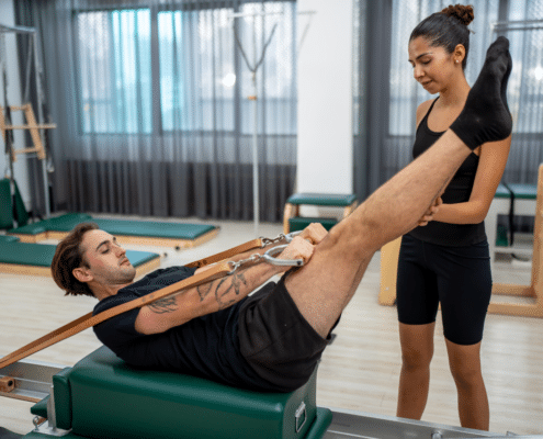 Reformer Pilates machine in use
