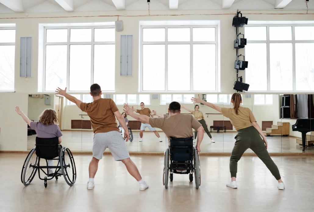 Diverse People Practicing Contemporary Dance, two in wheelchairs.