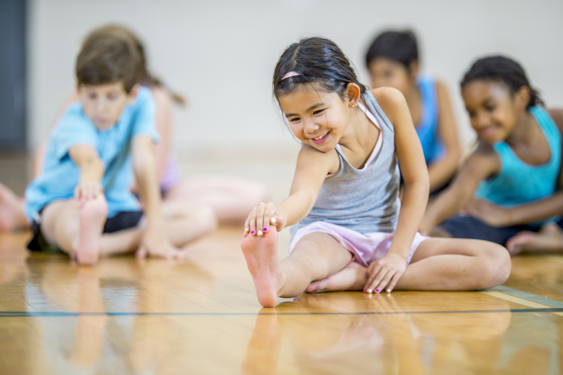 Multi-ethnic elementary age group stretching